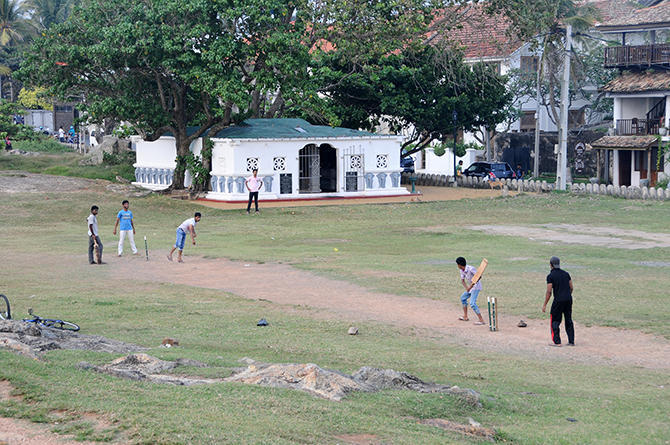 Modern life in the old town: Cricket players