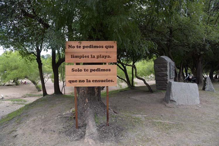 Campground sign "It´s not necessary that you clean the beach, just don´t make it dirty"