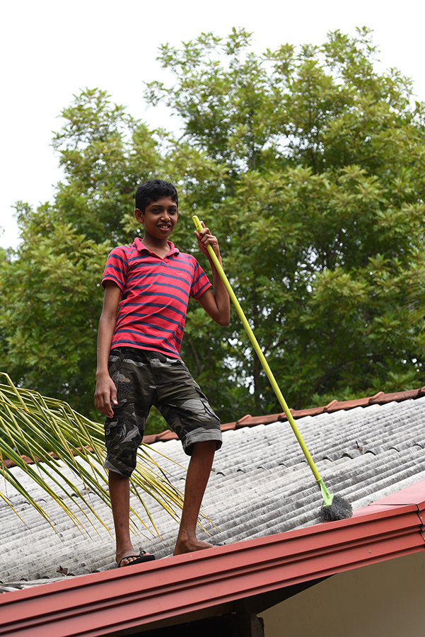 Meir cleaning the roof