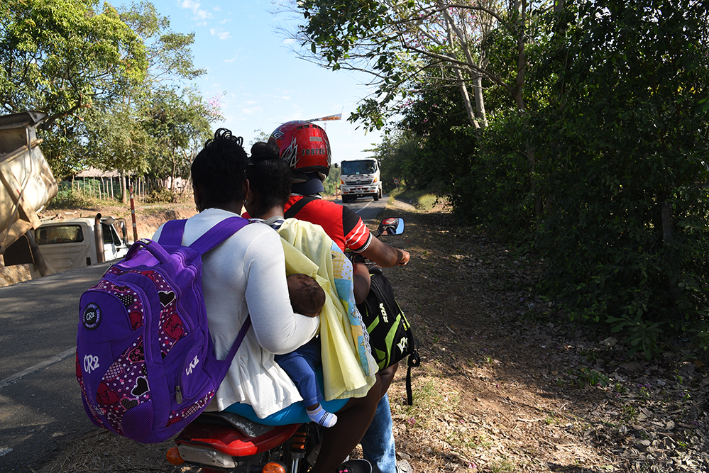 All the family on a motorbike taxi